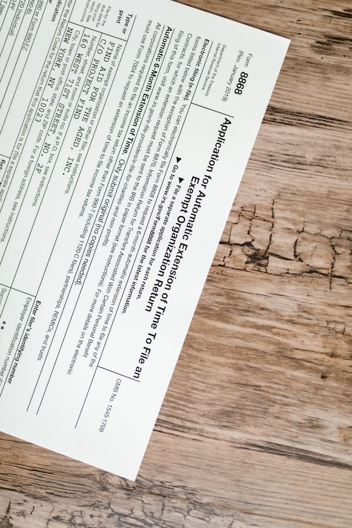 about-02 A tax form 8868 for filing extensions placed on a rustic wooden surface.