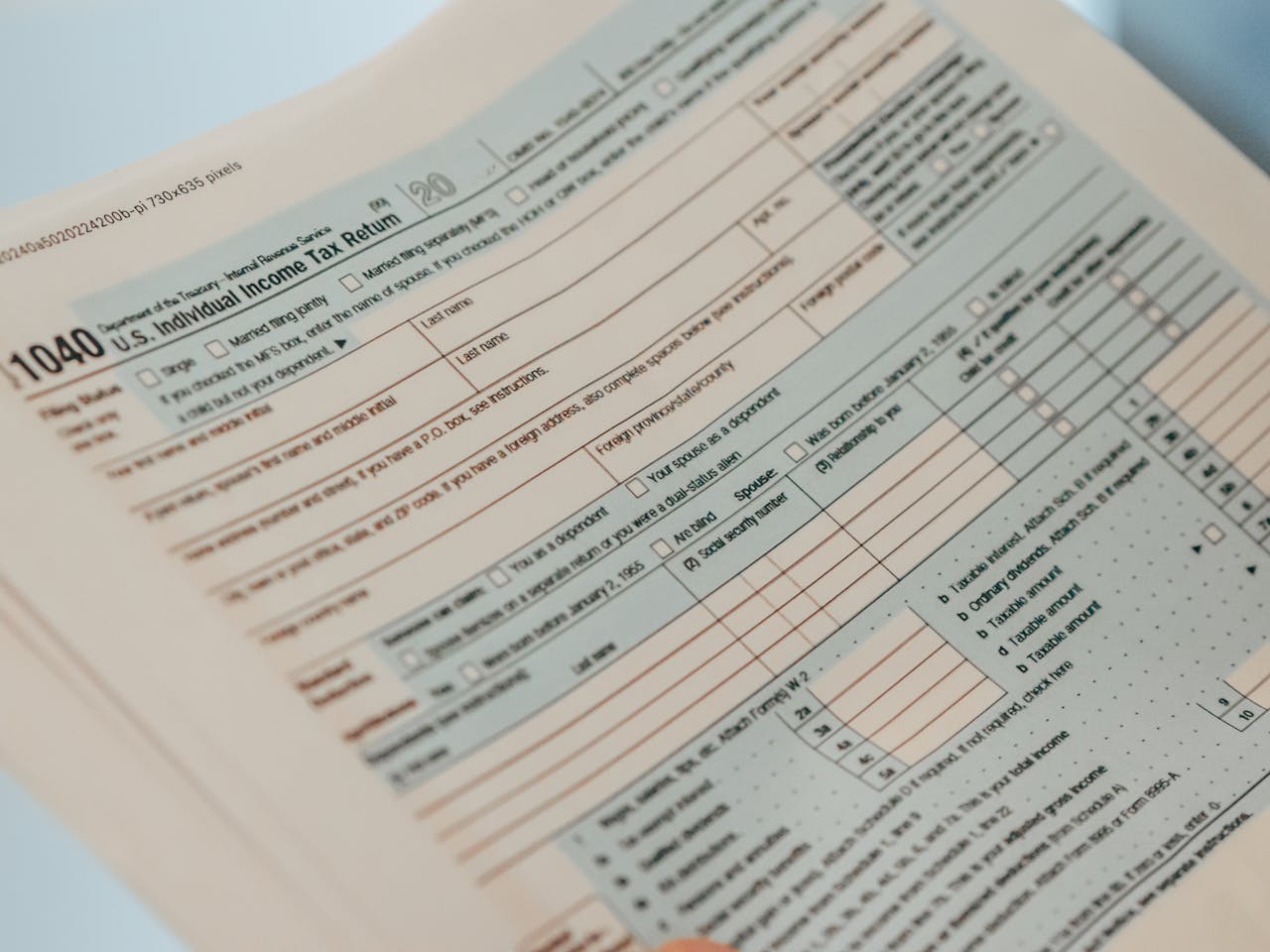 services-cta Detailed close-up image of a U.S. 1040 Individual Income Tax Return form, ideal for finance-related content.