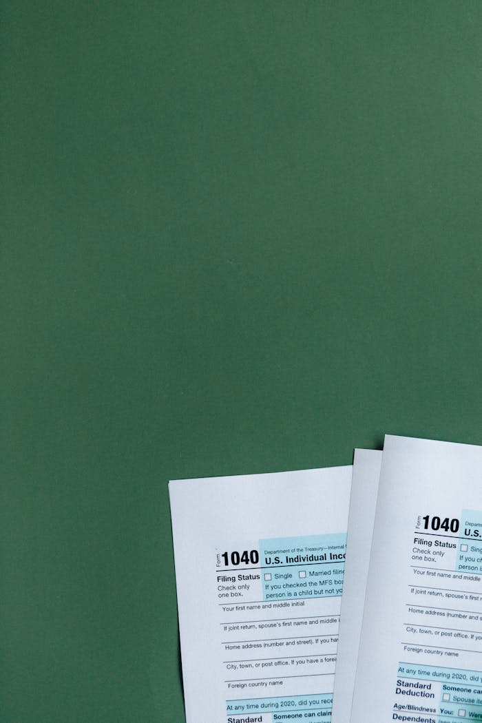 why-choose-us U.S. Tax Forms 1040 placed on a green surface, ideal for finance and taxation themes.